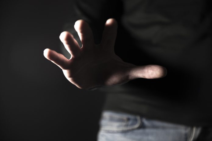 Hand reaching or attacking